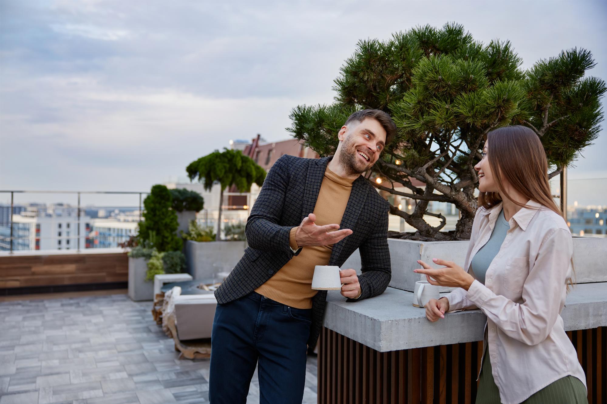 agent showing luxury apartment terrace